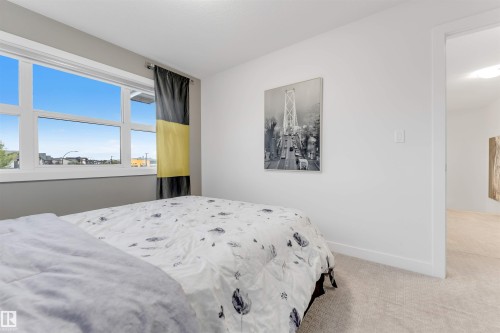 Bright window with white framing - 718 Charlesworth Way Sw, Edmonton, AB 