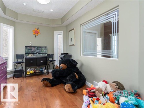 Wood-finish flooring, recessed lighting, and a tray ceiling - 496 Ravine Court, Devon, AB 