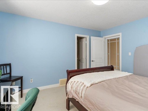 Recessed ceiling light, two interior panel doors, and a closet with bifold doors - 496 Ravine Court, Devon, AB 