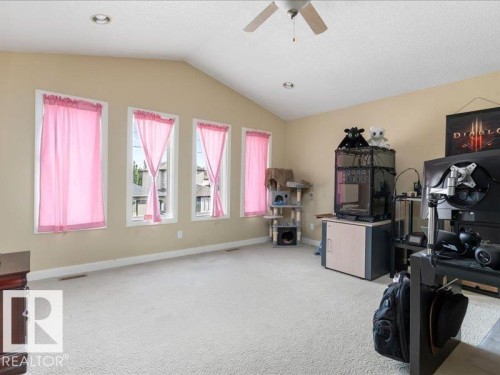 Vaulted ceiling with recessed lighting and ceiling fan - 496 Ravine Court, Devon, AB 
