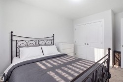 White walls with a textured finish, recessed lighting, and a bi-fold closet door - 