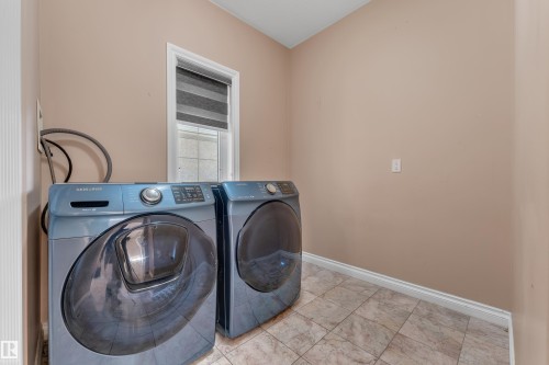 Tile flooring, light wall paint, and a window with blinds - 3455 29 Street Nw, Edmonton, AB 