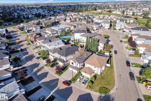 Residential neighborhood with a mix of single-family homes and mature landscaping - 3455 29 Street Nw, Edmonton, AB 
