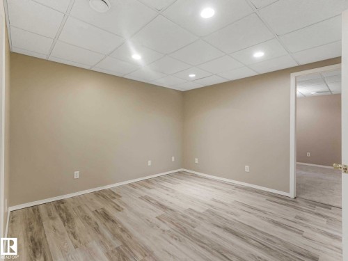 Recessed lighting, light-toned walls, wood-finish flooring, and drop ceiling - 15916 88B Avenue Nw, Edmonton, AB 