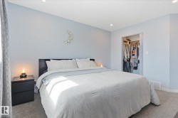 Recessed lighting, light-colored walls, and carpet flooring - 