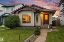 Light-colored siding exterior with dark trim accents - 2109 37 Avenue Nw, Edmonton, AB 