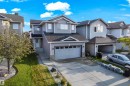 Contemporary two-story residence featuring light gray siding and a dark shingle roof - 3003 25 Avenue Nw, Edmonton, AB 