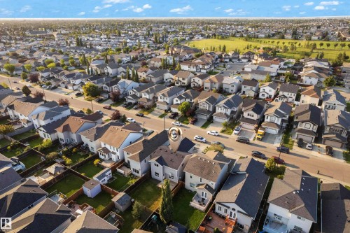 Residential neighborhood with varied house styles, surrounded by green spaces - 3003 25 Avenue Nw, Edmonton, AB 