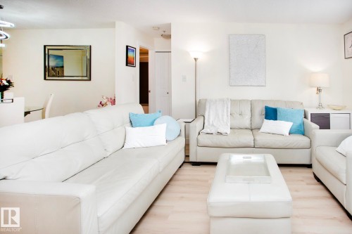 Light wood-finish flooring throughout - #201 1070 Mcconachie Bv Nw, Edmonton, AB 