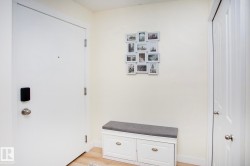 Light-toned walls, wood-finish flooring, and white doors - 