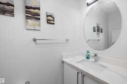 Modern bathroom vanity with an integrated rectangular sink, stone-finish countertop, and chrome faucet - 