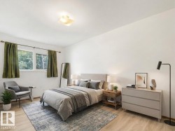White walls, wood-finish flooring, two large windows, flush-mount ceiling light - 