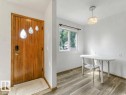 Wood-finish flooring, white walls, and a window with exterior visibility - 16428 88 Avenue Nw, Edmonton, AB 