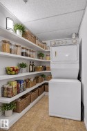 Virtually staged pantry/storage in laundry room - 