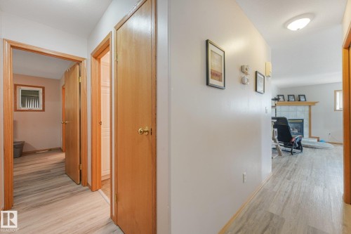 Hallway featuring wood-finish flooring, light neutral wall tones, and recessed lighting - 54 Buskmose Dr, Rural Wetaskiwin County, AB - Indoor Photo Showing Other Room