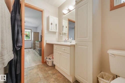 Bathroom featuring a vanity with white cabinetry, a countertop, and a built-in sink - 54 Buskmose Dr, Rural Wetaskiwin County, AB - Indoor Photo Showing Bathroom