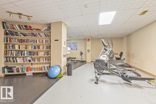 Fitness area featuring an elliptical machine, rowing machine, and treadmill - #1307 10045 117 St Nw, Edmonton, AB 