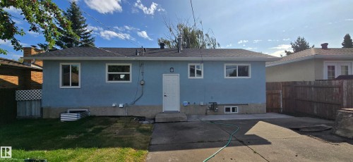 Light blue exterior with white trim windows and door - 13812 63 Street Nw, Edmonton, AB 