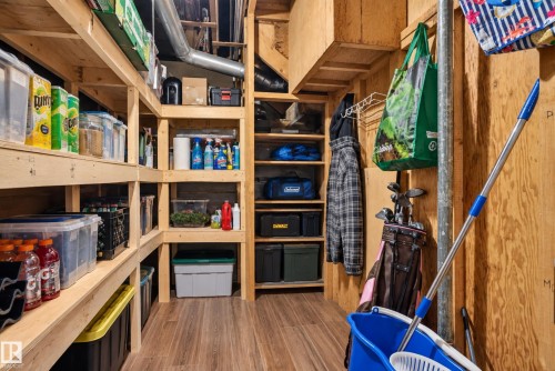 Extensive wooden shelving system, wood-finish flooring, exposed ductwork, and plywood wall finish - 11406 83 Street Nw, Edmonton, AB 