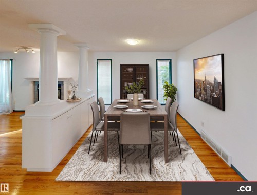 Wood-finish flooring, white built-in cabinetry, two decorative columns, and recessed windows with dark trim - 10941 81 Avenue Nw, Edmonton, AB 