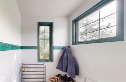 Window with gridded panes and teal trim - 