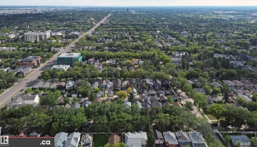Aerial perspective showcasing extensive tree coverage throughout the neighborhood - 10941 81 Avenue Nw, Edmonton, AB 