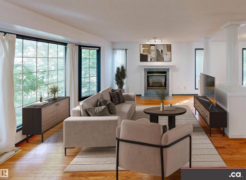 Hardwood flooring throughout, a large grid-pane window, a fireplace with a mantel, and architectural columns - 10941 81 Avenue Nw, Edmonton, AB 