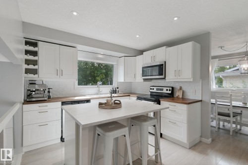 White cabinetry and wood-finish countertops - 5 Labelle Crescent, St. Albert, AB 
