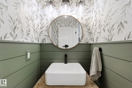 Shiplap wainscoting with a botanical print wallpaper - 5 Labelle Crescent, St. Albert, AB 