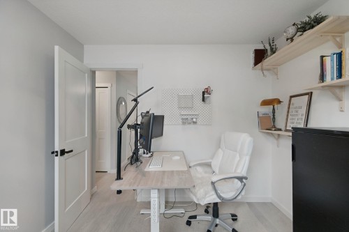 Light-toned wood-finish flooring complements the neutral wall color - 5 Labelle Crescent, St. Albert, AB 