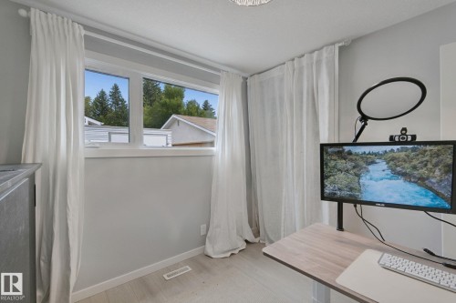 Recessed lighting, wood-finish flooring, and white window trim - 5 Labelle Crescent, St. Albert, AB 