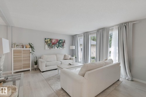 Light-toned wood-finish flooring, multiple windows, and a neutral color palette - 5 Labelle Crescent, St. Albert, AB 