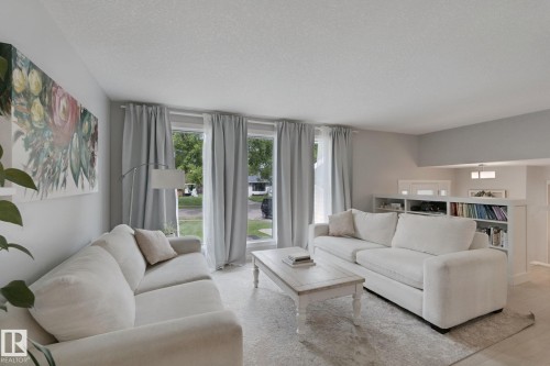 Multiple windows, built-in shelving, recessed lighting, and a neutral color palette - 5 Labelle Crescent, St. Albert, AB 