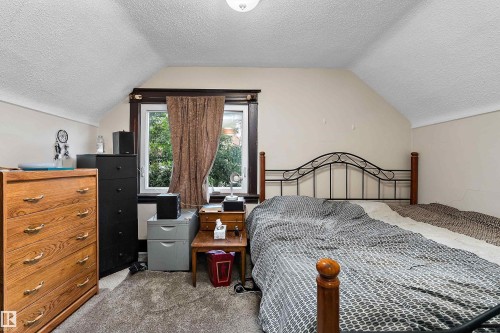 Window with dark wood trim - 10816 92 Street Nw, Edmonton, AB 