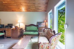 Vaulted wood-plank ceiling complemented by light wood-finish flooring - 