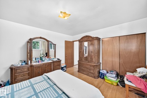 Hardwood-style flooring throughout - 15703 84 Avenue Nw, Edmonton, AB - Indoor Photo Showing Bedroom