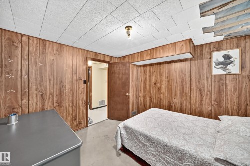 Wood-panel wall finishes with a drop ceiling - 15703 84 Avenue Nw, Edmonton, AB - Indoor