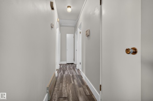 Wood-finish flooring, white trim, light-toned walls, and recessed lighting - 13512 111 Street Nw, Edmonton, AB 