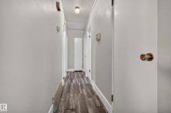 Wood-finish flooring, white trim, light-toned walls, and recessed lighting - 