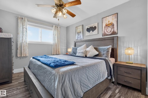 Light gray painted walls with wood-finish flooring - 13512 111 Street Nw, Edmonton, AB 