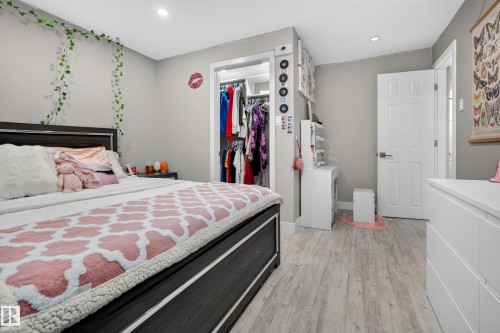 Recessed lighting, wood-finish flooring, and light gray wall paint - 13512 111 Street Nw, Edmonton, AB 