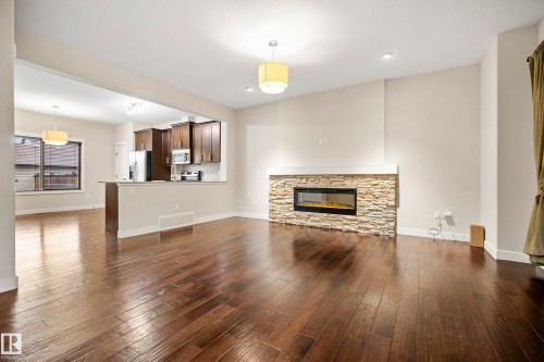 23 Greenbury Boulevard, Spruce Grove, AB - Indoor Photo Showing Living Room With Fireplace