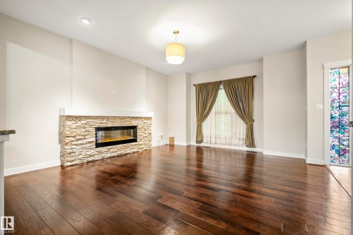 23 Greenbury Boulevard, Spruce Grove, AB - Indoor Photo Showing Living Room With Fireplace