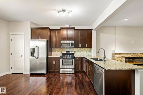 23 Greenbury Boulevard, Spruce Grove, AB - Indoor Photo Showing Kitchen With Stainless Steel Kitchen With Double Sink With Upgraded Kitchen