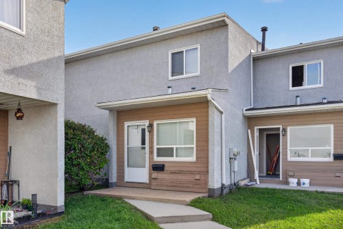 Stucco exterior with brown siding accents - 17749 95 Street Nw, Edmonton, AB 