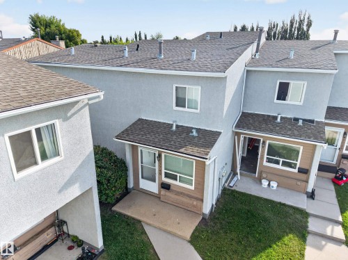 Multi-level exterior with stucco finish and asphalt shingle roof - 17749 95 Street Nw, Edmonton, AB 