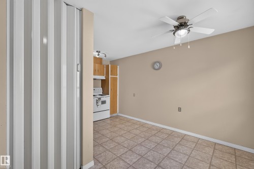 Neutral-toned walls, tile flooring, and a ceiling fan with integrated lighting - 17749 95 Street Nw, Edmonton, AB 