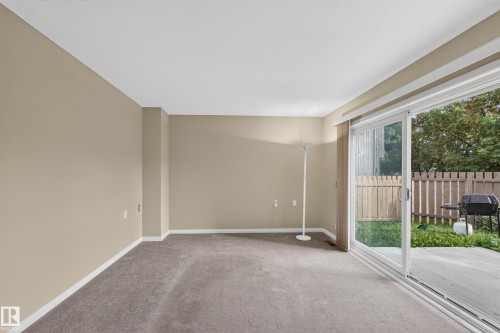 Carpeted interior space with neutral wall tones - 17749 95 Street Nw, Edmonton, AB 