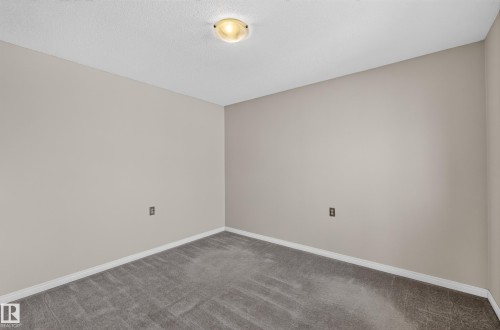 Recessed ceiling light fixture, neutral wall paint, white trim, and gray carpeting - 17749 95 Street Nw, Edmonton, AB 