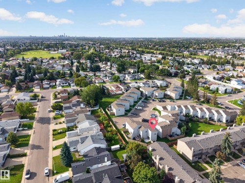 Residential neighborhood with varied housing styles, mature trees, and visible green spaces - 17749 95 Street Nw, Edmonton, AB 